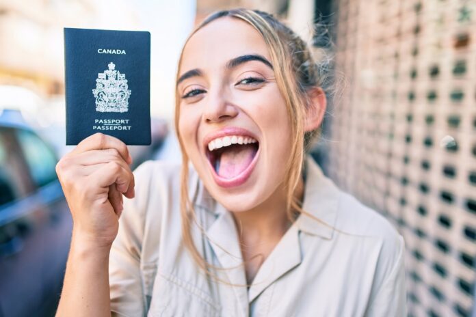 Young,Beautiful,Blonde,Caucasian,Woman,Smiling,Happy,Outdoors,On,A move-to-canada-from-the-uk